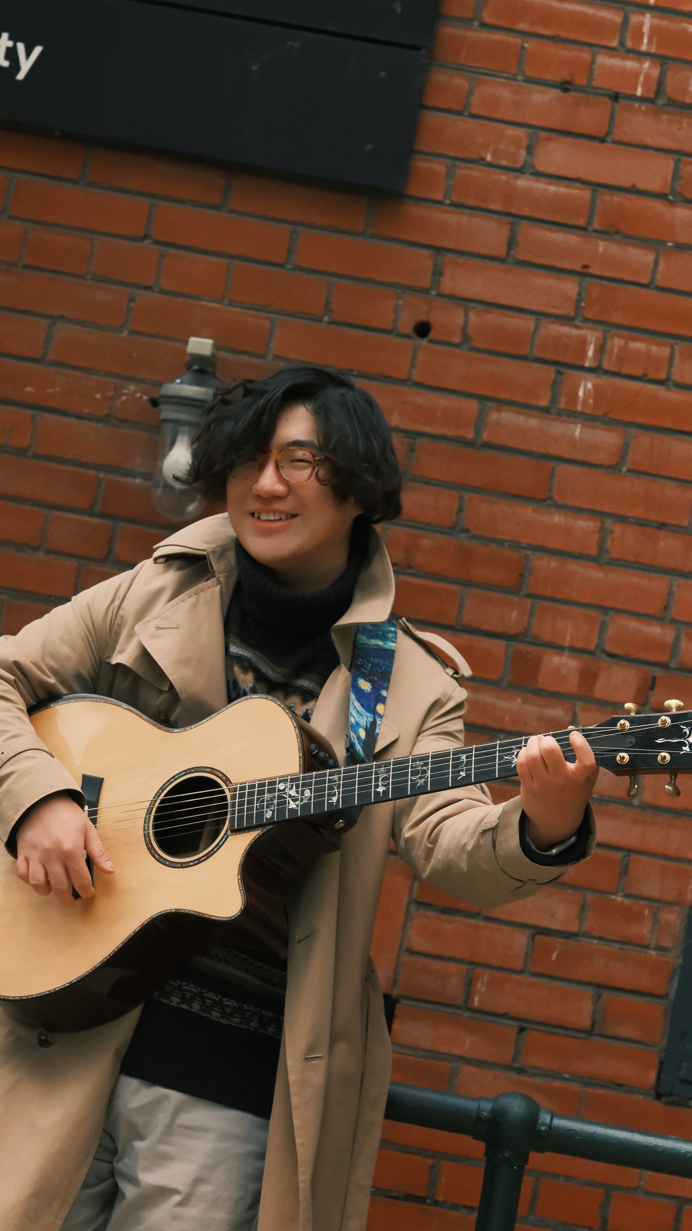 Sam playing guitar